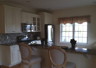 white cabinets with glass doors