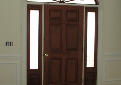 Front door with curved transome
